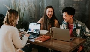 People smiling because they've just mastered how to create a candidate persona for their school